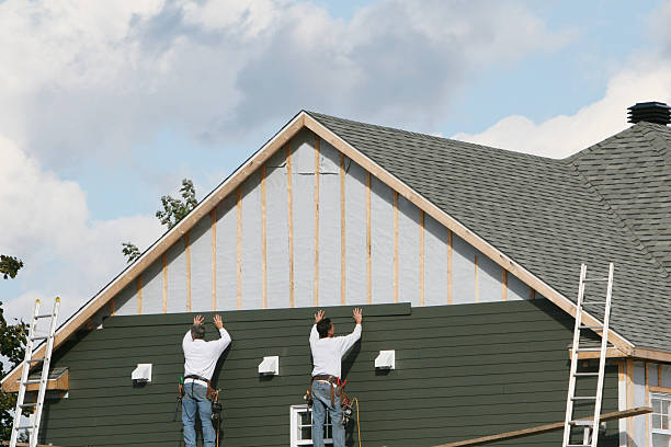 Professional Vinyl Siding technician working in Utica, IN